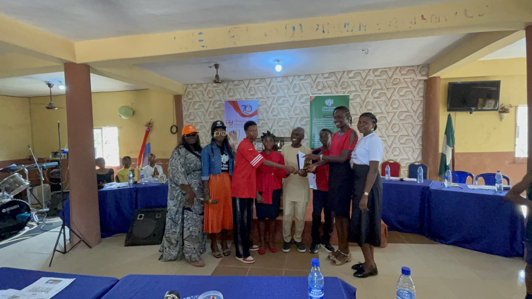 Winning team receiving recognition at the inter-church debate