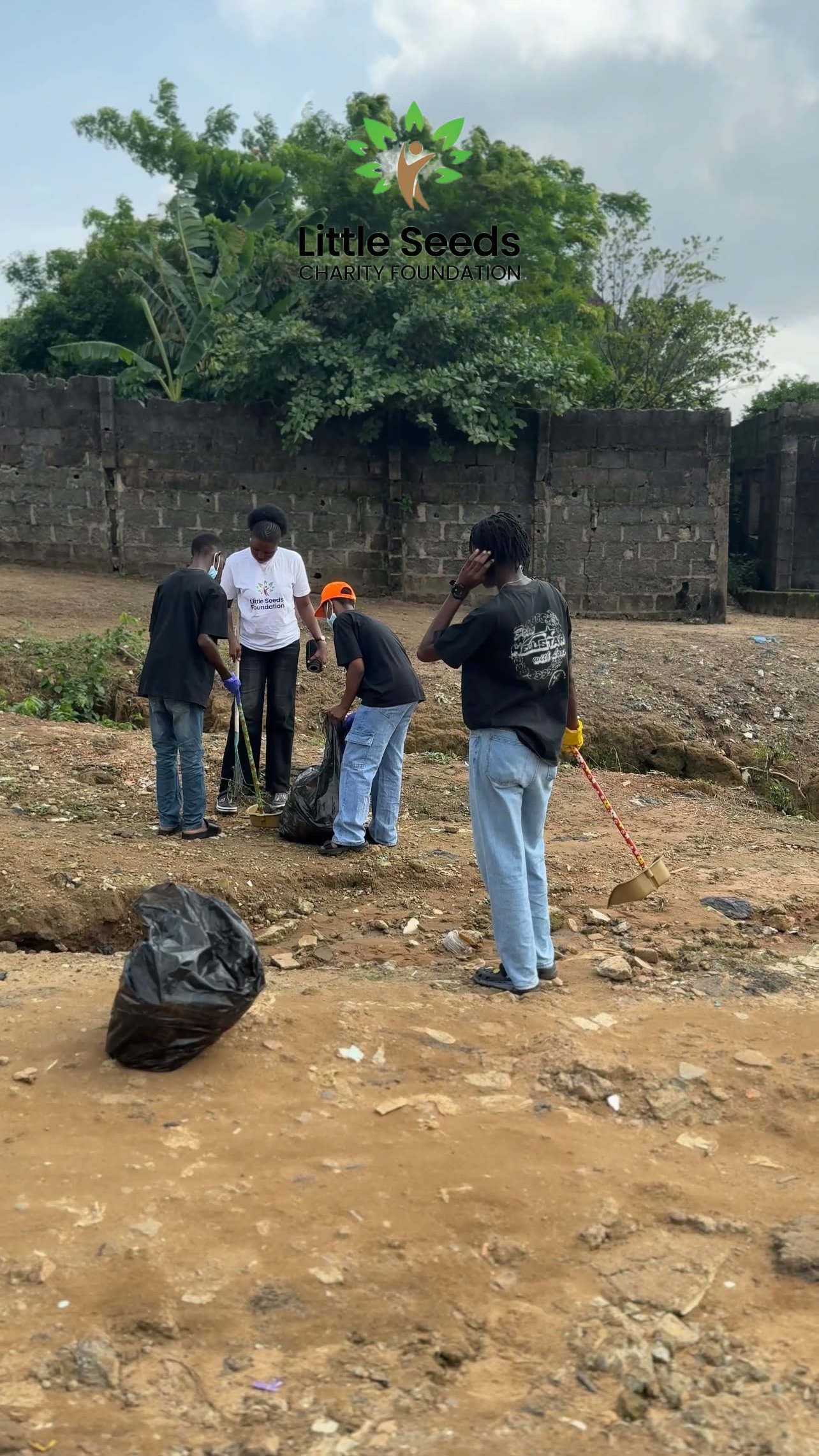 Volunteers collecting waste during the community cleanup