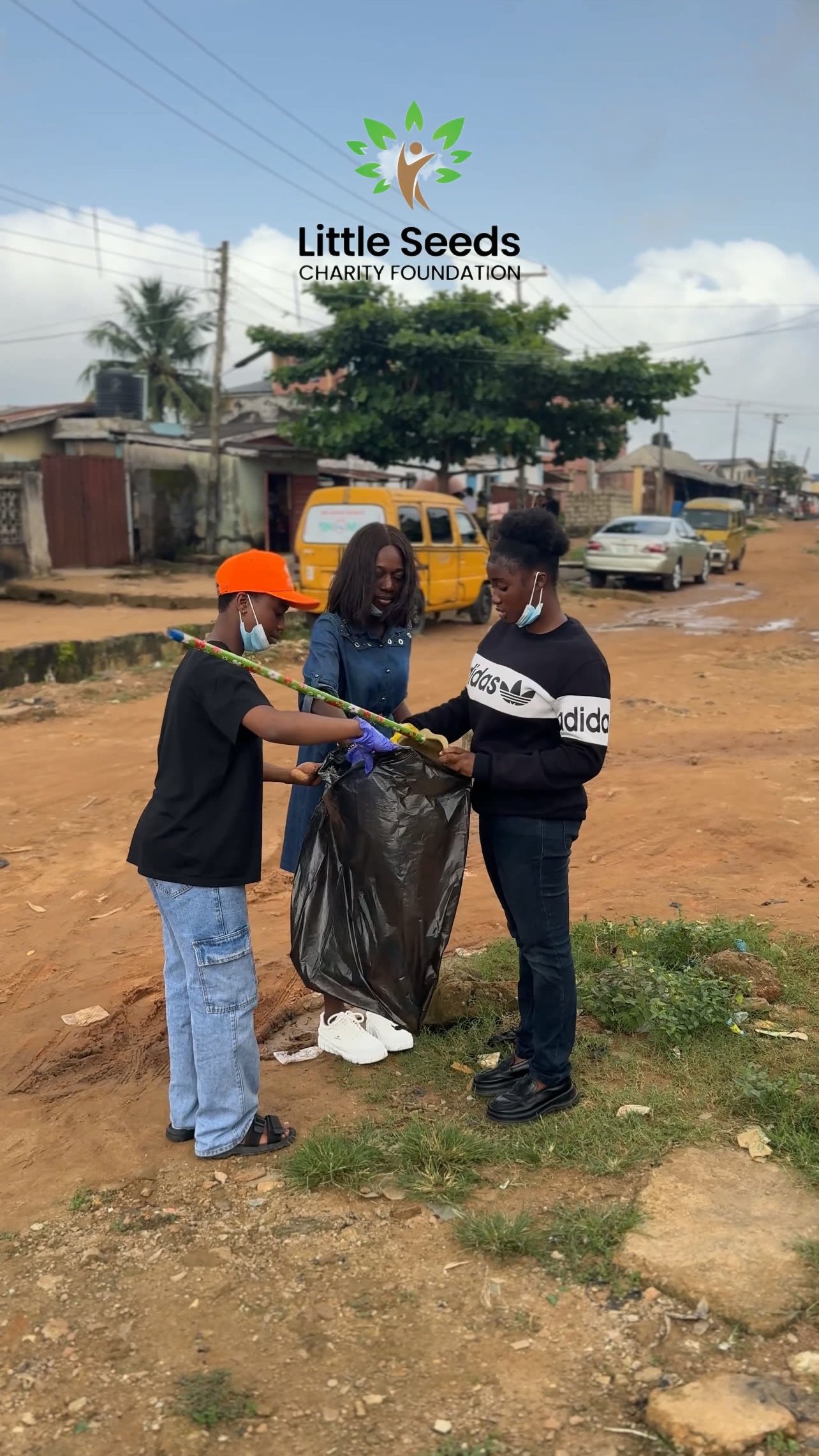 Teenagers working together during the community cleanup